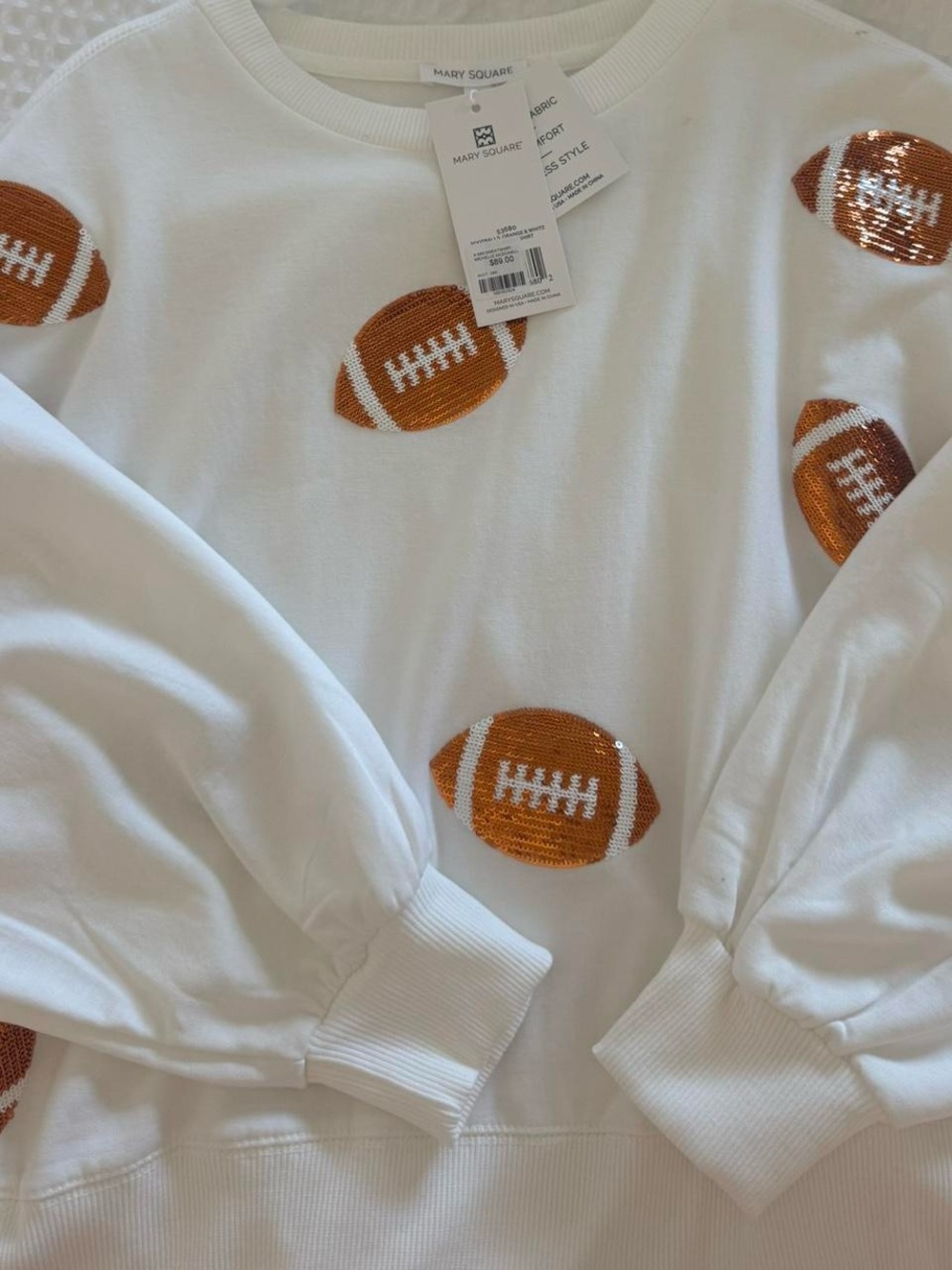 Mary Square White Sweatshirt with Orange Football Sequin Motif